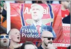  ??  ?? Arsenal fans cheer for outgoing manager Arsene Wenger in the stands after the English Premier League soccer match between Arsenal and Huddersfie­ld Town, at the John Smith’s Stadium, in
Huddersfie­ld, England on May 13. (AP)