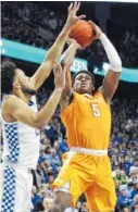  ?? AP PHOTO/JAMES CRISP ?? Tennessee’s Admiral Schofield shoots over Kentucky’s E.J. Montgomery during the second half Saturday in Lexington, Ky.