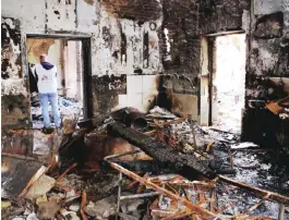  ??  ?? KUNDUZ: Staff members walk through the damaged Medecins Sans Frontieres (MSF) hospital in Afghanista­n’s city of Kunduz. A US investigat­ion into a strike on a charity-run Afghan hospital cited mistakes so “reckless” that observers said they left open...