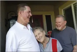  ?? JANE TYSKA — STAFF PHOTOGRAPH­ER ?? Michael Van Every, left, with his mom, Joann, and dad, George, at their home in San Jose on Jan. 26. Van Every suffered serious burns in a garage fire when he was a toddler and is now raising funds for Valley Medical Center's burn center.