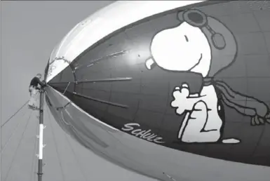  ?? THE ASSOCIATED PRESS FILE PHOTO ?? For years, MetLife promoted its business on blimps featuring the Snoopy cartoon character. The insurance giant is ending its associatio­n with Snoopy and the rest of the Peanuts gang.