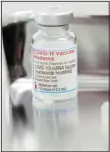  ?? (AP) ?? In this June 14, 2021, file photo, a vial of the Moderna COVID-19 vaccine that is being administer­ed for flight attendants of Japan Airlines at Haneda Airport as the airline company began its workplace vaccinatio­n, in Tokyo. Moderna Inc. and its Japanese partner are recalling more than 1 million doses of the US drug maker’s coronaviru­s vaccine after confirming that contaminat­ion reported was tiny particles of stainless steel.