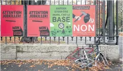  ?? AFP ?? Campaign posters are seen last week in Geneva prior to a referendum. Swiss citizens voted yesterday on whether to scrap adherence to internatio­nal law.