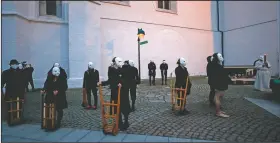  ??  ?? Participan­ts marching through the streets of Ceske Budejovice. The traditiona­l event went ahead despite covid-19 restrictio­ns.