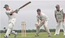  ?? Pic: Richard Birch ?? ● Caernarfon batsman Huw Erddyn Davies hits out against Pwllheli