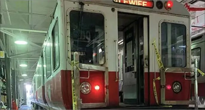  ?? NTSB PHOTO ?? OUT OF SERVICE: Police tape is draped on a Red Line train after a fatal accident at Broadway Station where a man got his arm stuck in a door as the train departed.