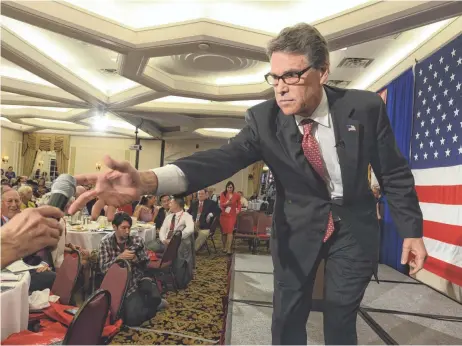  ?? DARREN MCCOLLESTE­R, GETTY IMAGES ?? Former Texas governor Rick Perry speaks at the First in the Nation Republican Leadership Summit Friday in Nashua, N.H.