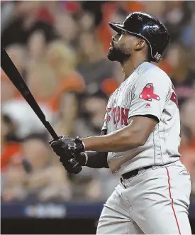  ?? STAFF PHOTOS BY CHRISTOPHE­R EVANS ?? DEEP IMPACT: Jackie Bradley Jr. watches his grand slam leave Minute Paid Park (above) then celebrates at home plate with Brock Holt (left) in the eighth inning of the Red Sox’ 8-2 win against the Astros in Game 3 of the ALCS yesterday in Houston. The Sox took a 2-1 series lead, with Game 4 tonight.