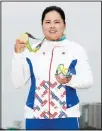  ??  ?? In this Aug 20, 2016 file photo, Inbee Park, of South Korea, holds up her gold medal after the final round of women’s golf at the Summer Olympics in Rio de Janeiro, Brazil. With the postponeme­nt of the Tokyo Games, Park gets more time to try to boost her world ranking and try to defend her
gold medal in 2021. (AP )