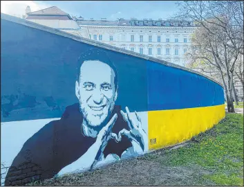  ?? Philipp-moritz Jenne The Associated Press ?? A mural of Alexei Navalny in Vienna, Austria, on Wednesday. Two portraits of the late Russian opposition leader were spray-painted behind a monument to Soviet soldiers.