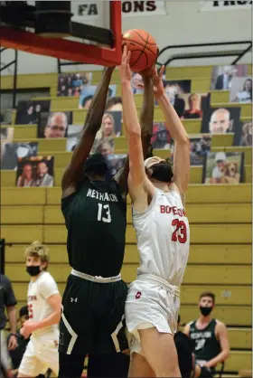  ?? OWEN MCCUE - MEDIANEWS GROUP ?? Methacton’s Cole Hargrove, left, grabs a rebound over Boyertown’s David Leh.