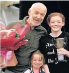  ??  ?? Young person of the year Eve Campbell with her granddad Alan Grant and little sister Summer (6)