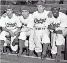  ?? APRIL 1947 AP FILE PHOTO ?? From left, Brooklyn Dodgers players John Jorgensen, Pee Wee Reese, Ed Stanky and Jackie Robinson at Ebbets Field in New York.