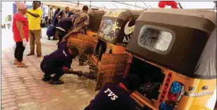  ??  ?? Mechanical experts attending to TVS Tricycles brought by riders to the Ajah check up camp