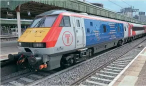  ??  ?? Transport for Wales DVT 82226 now carries vinyls supporting the work done by the Alzheimer’s Society – one of a number of similar vinyl wraps applied to TFW DVTS. 82226 stands at Cardiff on July 13. Spencer Conquest