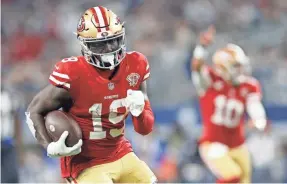  ?? TIM HEITMAN/USA TODAY SPORTS ?? 49ers versatile, dual-threat wide receiver Deebo Samuel runs for a touchdown in the third quarter against the Cowboys.