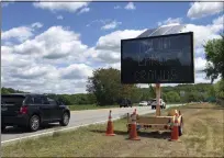  ?? SUSAN HAIGH-ASSOCIATED PRESS ?? Drivers on Connecticu­t Route 2, in Preston, Conn., Monday, June 1pass one of four electronic signs erected Sunday night by the state to warn patrons of Foxwoods Resort Casino and Mohegan Sun about the potential dangers of being a large crowd and urging them not to “gamble with COVID.” Both tribal casinos, closed since March 17, opened despite opposition from Connecticu­t Gov. Ned Lamont, who has limited power regarding the sovereign nations.