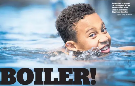  ?? Photo / Jason Oxenham ?? Kohen Deck, 8, cools off in the pool under the Silo Park Wind Tree at Auckland’s Wynyard Quarter.