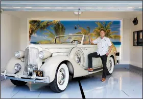  ?? For The Washington Post/DOUGLAS HILL ?? of Coronado, Calif., has a custom garage for his 1935 Packard 1201 coupe convertibl­e — among others — with two subterrane­an parking spaces and a giant mural of the beach framed by LED lights.