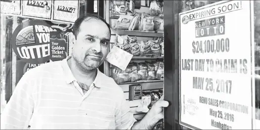  ??  ?? HURRY! Tribeca bodega owner Bobby Patel sold a jackpot-winning ticket last year that hasn’t yet been claimed. He’s trying to spread the word.