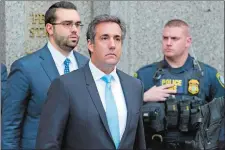  ?? MARY ALTAFFER/AP PHOTO ?? Michael Cohen, President Donald Trump’s personal attorney, center, leaves federal court in New York on Monday.