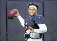  ??  ?? Cardinals quarterbac­k and former Oklahoma star Kyler Murray smiles as he throws a pass during practice on Tuesday in Glendale, Ariz. [AP PHOTO/ROSS D. FRANKLIN]