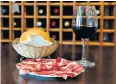  ?? ?? ▼ You’re in Spain, remember… pair the best jamón ibérico with a glass of rioja in the resort