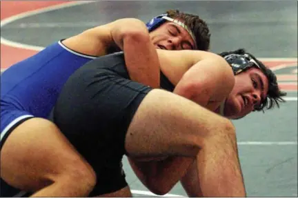  ?? BOB RAINES — DIGITAL FIRST MEDIA ?? Brian Fennell (Wissahicko­n) wrestles Josh Wileczek (Downingtow­n East) in the 195-pound consolatio­n bout at the Ralph Wetzel Classic Saturday.