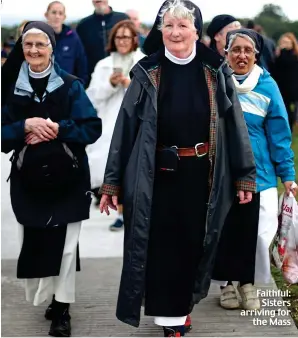  ??  ?? Faithful: Sisters arriving for the Mass