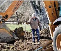  ?? CHRIS STEWART / STAFF ?? Chris Townsend, an employee of Horizon Concrete in Troy, checks the depth of a trench for a garage foundation being dug Monday in Harrison Twp. at the site of the first Pathways Project home. The program is an initiative to provide tornado survivors previously renting with the ability to become homeowners.