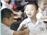  ??  ?? Pupils of SKJC Chung Hwa Kota Kinabalu settle down comfortabl­y on the first day of schooling.