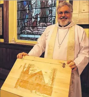  ?? SUBMITTED PHOTO ?? John Clarke displays the pine chest donated by Phase II’s frontman, Gerry Hickey, to use in collecting donations of food and supplies for the St. paul’s Church’s outreach program in Charlottet­own.