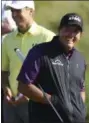  ?? DAVE THOMPSON — THE ASSOCIATED PRESS ?? Phil Mickelson of the United States, right and Jordan Spieth of the United States smile as they wait to putt on the 4th green during a practice round ahead of the British Open Golf Championsh­ip, at Royal Birkdale, Southport, England on Tuesday.