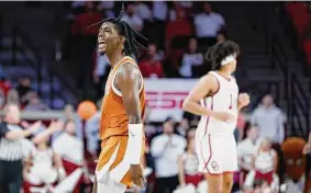  ?? Garett Fisbeck/Associated Press ?? UT guard Marcus Carr celebrates during Saturday’s win. Carr scored 13 points for the Longhorns, who improved to 5-0 under acting coach Rodney Terry.