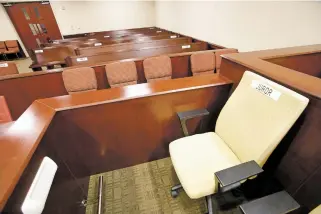  ?? LUIS SÁNCHEZ SATURNO/THE NEW MEXICAN ?? Jury seating has been spread out in District Court Judge Bryan Biedscheid’s courtroom, taking up half the audience seating. Jury trials will resume under the First Judicial District Court’s reopening plan approved by the state Supreme Court.