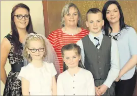  ??  ?? Mollie Herlihy on her First Holy Communion Day in Knocknagre­e with her Mam Claire and siblings. Photo: Eileen O'Connor