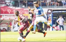  ??  ?? Napoli’s Albanian defender Elseid Hysaj (center), vies for the ball during the Italian Serie A football match between Torino and Napoli at the Olimpico Grande Torino stadium in Turin on Sept 23. (AFP)