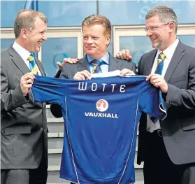  ??  ?? Mark Wotte with SFA chief executive, Stewart Regan and the then Scotland manager, Craig Levein, at his unveiling as performanc­e director in 2011