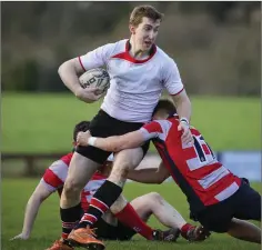  ??  ?? Wicklow’s Ben Porter is tackled by Mullingar’s Ronan Wallace.