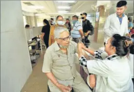  ?? SUNIL GHOSH/HT PHOTO ?? A senior citizen gets inoculated with a booster dose of Covid vaccine, in Noida.