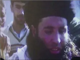  ??  ?? In this file image made from video broadcast on Nov. 7, 2013, undated footage of Mullah Fazlullah is shown on a projector in Pakistan. An Afghan defense ministry official says Friday, a US drone strike in northeaste­rn Kunar province killed Pakistan...