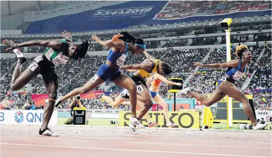  ?? PHOTO: REUTERS ?? Mission accomplish­ed . . . American Nia Ali crosses the finish line to win the women’s 100m hurdles final at the world athletics championsh­ips in Doha yesterday. Fellow American Kendra Harrison (also in blue) claims silver, Jamaican Danielle Williams (in gold) takes the bronze and Nigerian Oluwatobil­oba Amusan (in green) finishes fourth.