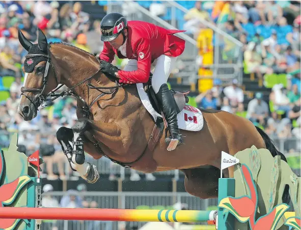  ?? DAVE ABEL/POSTMEDIA NEWS ?? Eric Lamaze of Team Canada jumps with Fine Lady 5 in the Equestrian Jumping 2nd Qualifier during the 2016 Rio Olympics on Tuesday. Lamaze won’t medal in team jumping but will be in the individual competitio­n Friday.