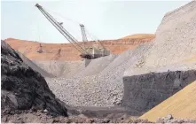  ?? MATTHEW BROWN/ASSOCIATED PRESS ?? A dragline excavator removes rocks above a coal seam at the Spring Creek Mine in Decker, Mont. The coal industry has been reeling from growing competitio­n from natural gas, wind and solar power.