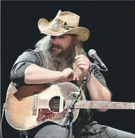  ?? MIKE WINDLE/GETTY IMAGES FOR COUNTRY MUSIC HALL OF FAME AND MUSEUM ?? Singer Chris Stapleton has devoted many songs to whiskey, much like the outlaw country singers he so clearly reveres.