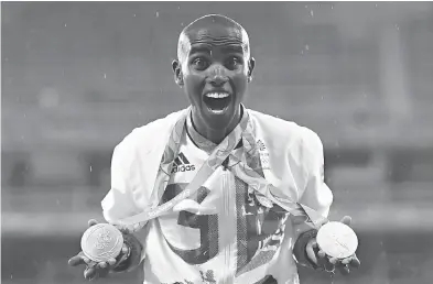  ?? ERIC FEFERBERG / AFP / GETTY IMAGES FILES ?? Britain’s Mo Farah was born in Somalia, has lived in the U.K. since age eight, and was knighted this year. Farah is based in Oregon, but is training in Ethiopia, and said he was worried he may not be allowed back into the U.S.