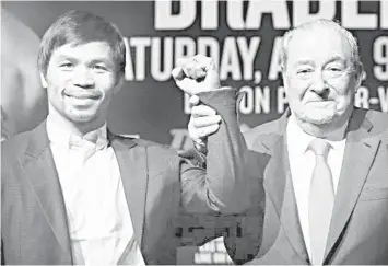  ?? PHILSTAR FILE PHOTO ?? The relationsh­ip of Filipino ring star Manny Pacquiao and his estranged promoter Bob Arum plunges into a new low after Pacquiao announced he is taking legal action against his former promoter Top Rank Inc. and other parties over what he claimed as “non-payment” of fees for the broadcast rights of his fight with Lucas Matthysse last July.