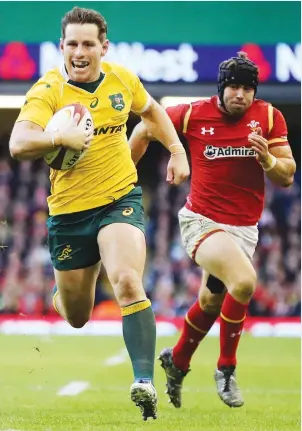  ?? PICTURE: Getty Images ?? Rout: Bernard Foley runs in one of Australia’s five tries in their 32-8 victory over Wales last season