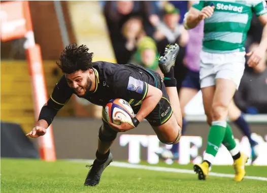  ?? PICTURES: Getty Images ?? Big contributi­on: back row star Lewis Ludlam scores the third try for Northampto­n