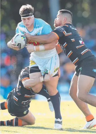  ??  ?? Titans captain Jarrod Wallace in action agains the Wests Tigers. Pictures: BRETT COSTELLO